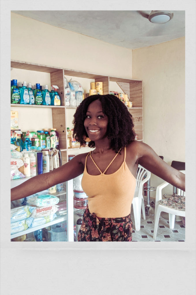 Final hair review (one month post). I am wearing my afro kinky curly clip in extensions from Amazing Beauty Hair, in the colour 1B. Photo was taken in my mother's store in Accra, Ghana.