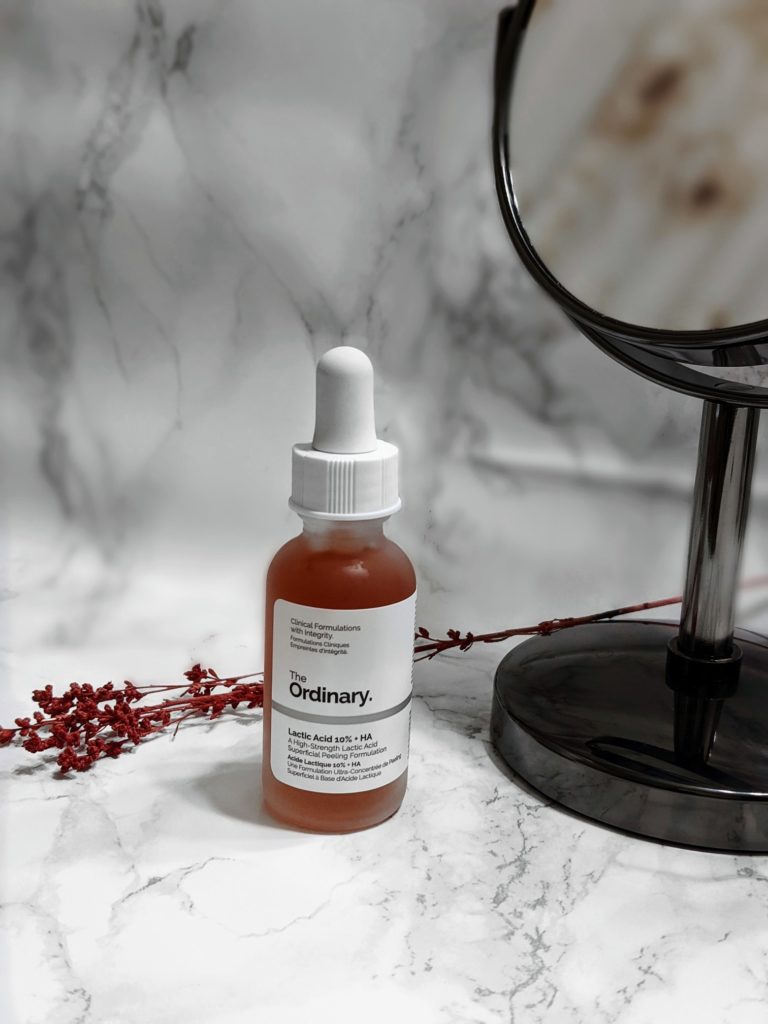 Sephora online purchase of The Ordinary's Lactic Acid 10% + HA ; retailed for $6.70 CAD , Size: 1oz, on marbled vanity counter with mirror and branch in the background for decoration