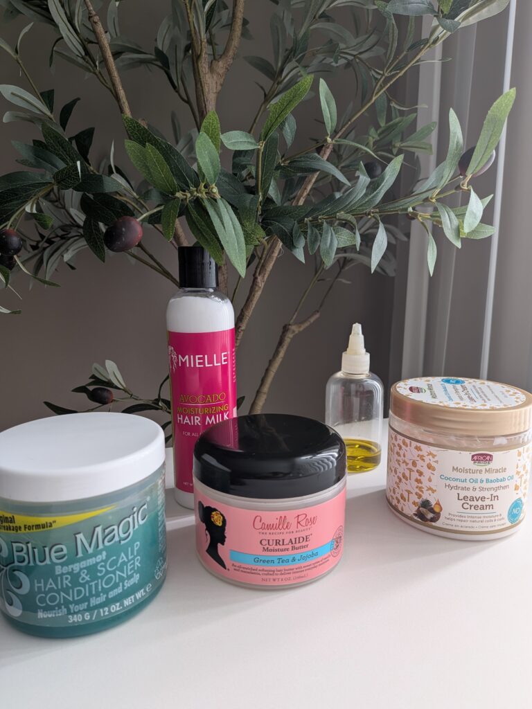 Must-have products Blue Magic Hair & Scalp, olive oil, Mielle Avocado Moisturizing Hair Milk, Camille Rose Natural Curlaide Moisture Butter, African Pride Moisture Miracle Hydrate & Strengthen Leave-in Conditioning Cream
