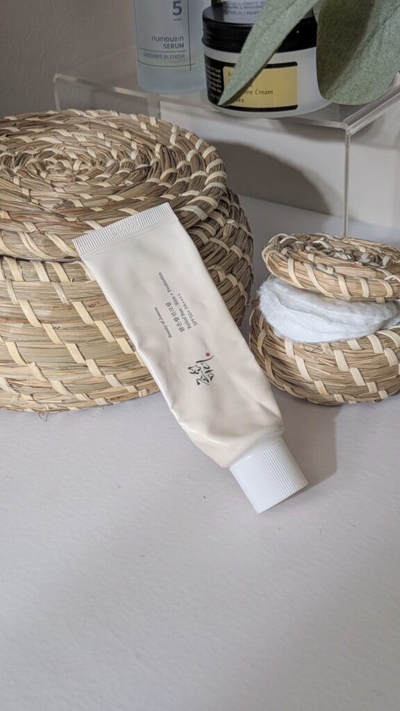 Beauty of Joseon Relief Sun Rice and Probiotics SPF 50 sunscreen tube on a vanity.